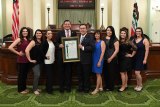 Lemoore Optometrist Dr. Jeff Garcia and his staff join Assemblymember Rudy Salas in Sacramento as the legislator honored Garcia and his business Family Eye Care.